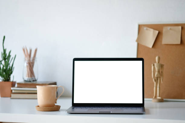 istock Workplace mockup concept. Selective focus Mockup home decor laptop computer and office object with copy space for products display montage.Mockup desktop 1079401884