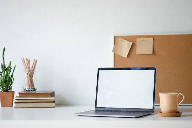istock Workplace mockup concept. Selective focus Mockup home decor laptop computer and office object with copy space for products display montage.Mockup desktop 1079401916