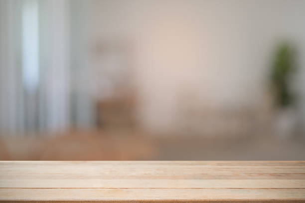 istock Montage wooden desk with blur room background. 1079411812