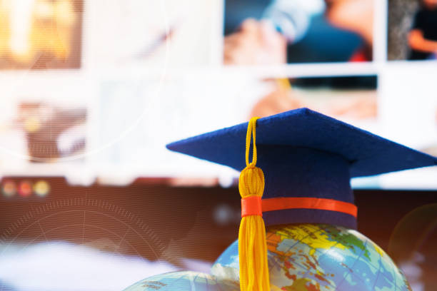 istock Graduated or Graduation university study  international Conceptual, Congratulations hat on Earth world globe model with Radar background on desk computer screen e-learning online classroom in school 1079411896