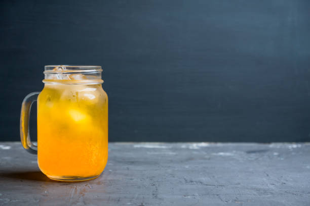 istock Icy cold mandarin beverage on the rustic background 1079421306