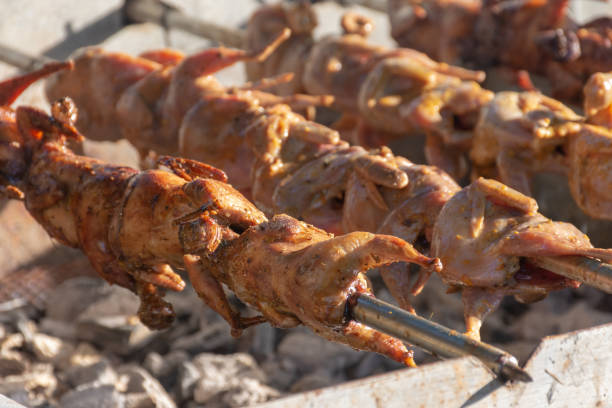 istock grilling quails over charcoal stove 1079424944