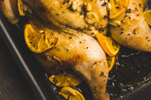 istock Christmas chicken on the pan with spices and orange slices 1079430152