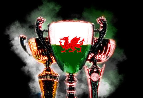 Trophy cup textured with flag of Wales. 2D Digital illustration.