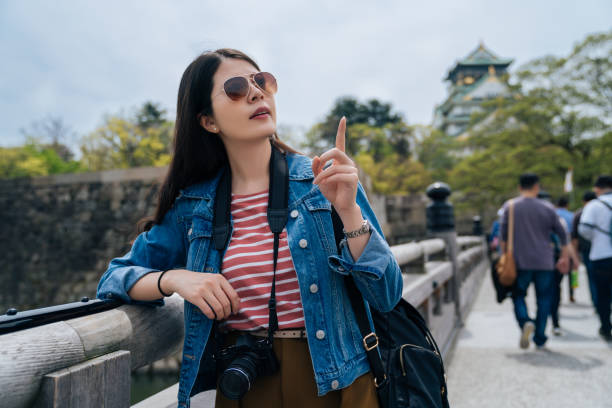 istock many people walking to osaka tower. 1079444772