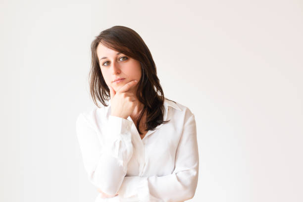 istock Pensive beautiful student holding chin 1079455026