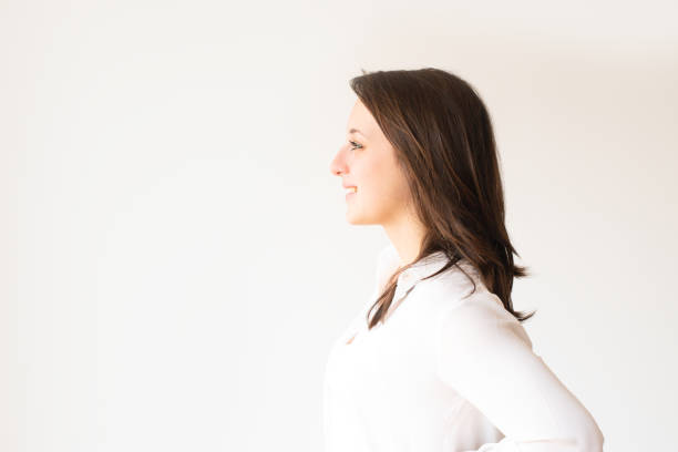 istock Profile portrait of smiling student in white blouse looking aside 1079455062