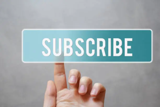 Photo of Subscribe - finger pressing blue button