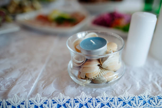 a candle among sea shells. decoration