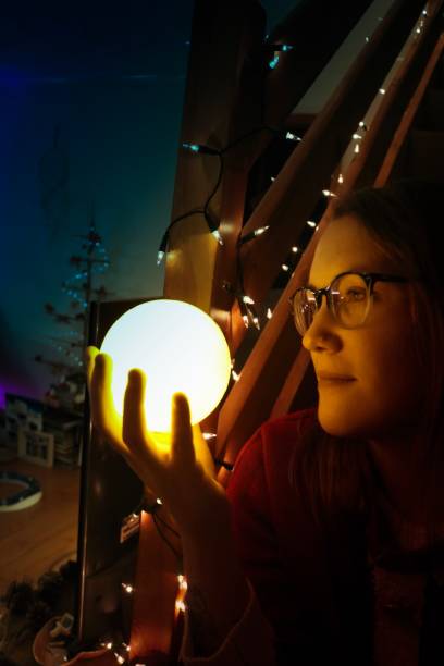 istock Woman with globe orb and light leaks 1079493600