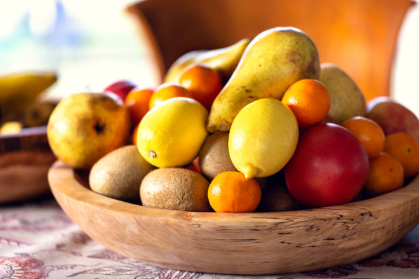 istock Table covered with a tablecloth and fruit on dishes in it. Shallow depth of field. 1079493810