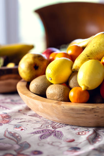 istock Table covered with a tablecloth and fruit on dishes in it. Shallow depth of field. 1079493818