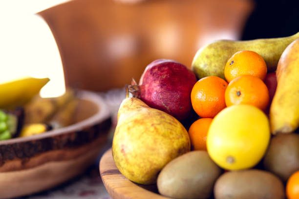 istock Table covered with a tablecloth and fruit on dishes in it. Shallow depth of field. 1079493830