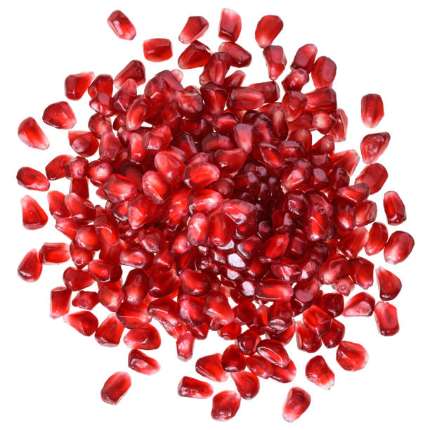 istock Cut the pomegranate with scattered grain top view isolated 1079514938