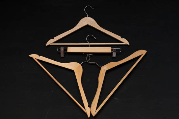 istock three hangers for clothes on black vintage 1079515338