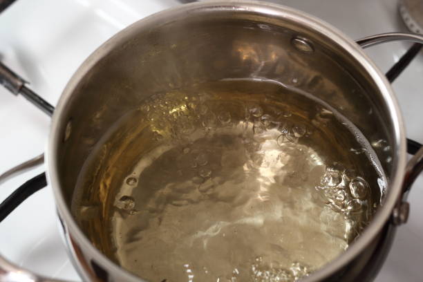 istock Boiling Cider in Pan on Gas Stove. Making Cider Pie Series. 1079527380