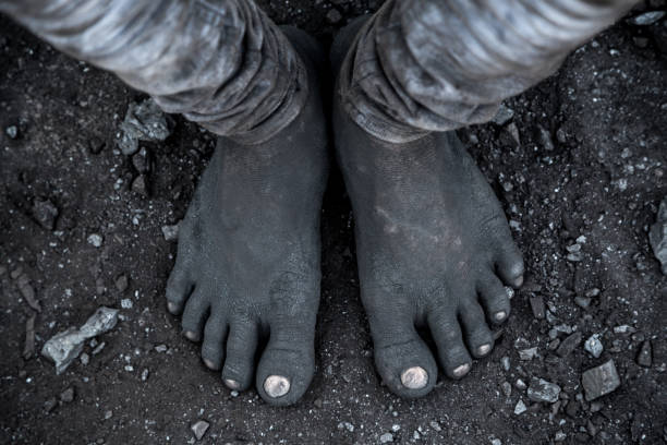 Coal is perhaps the most important energy resource that provides for the energy consumption in India as well as a larger share of the world. Jharia in Jharkhand is the most significant coal mine producing the largest share of coal in India and also in the whole of south Asia. Since the days it has come into operation, and from the discovery of underground fires (in 1916), this coal mine has seen a number of deaths. It has been rightly referred to as the death field. The poor lots who engage themselves in the mining activities to earn a living are affected the most. The major reasons of death here are underground fire, suspension of poisonous gases in the air, pollution, etc. Diseases with skin and lungs are thus widespread here. Moreover, extreme conditions of poverty, illnesses and higher illiteracy among the people force the villagers to sell their kids to the coal mining mafias. Nowadays, more are getting associated with this illegal mining activity for less than 2 USD, yet risking their lives a lot more.