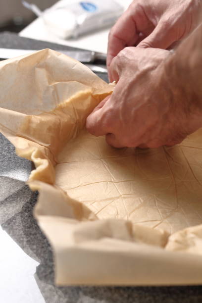 istock Line pastry sheet on pie dish. Making Cider Pie Series. 1079527928