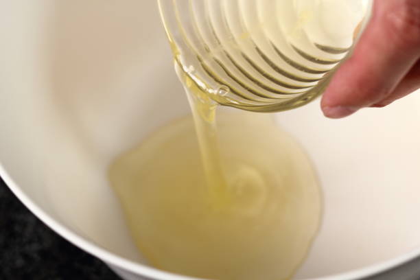 istock Pouring egg whites into bowl. Making Cider Pie Series. 1079529032