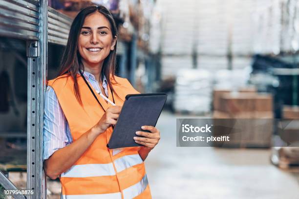 Warehouse Manager With Digital Tablet Stock Photo - Download Image Now - Warehouse, Freight Transportation, Women