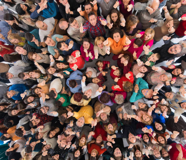istock Above view of crowd showing thumbs up. 1079552564