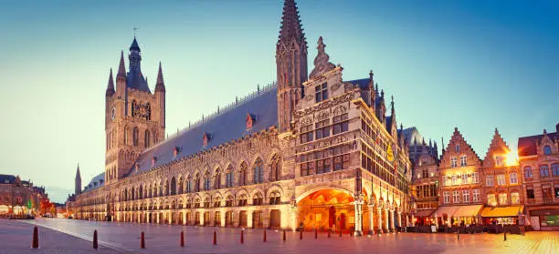 Panoramic view of the main square (The Market Place - Grote Markt), with town hall in Ypres by dusk