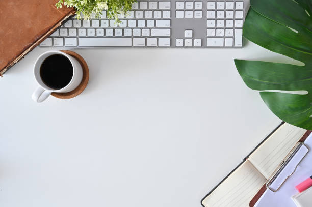 istock Office desk concept, Top view workspace hipster with computer, coffee, books and leaf decoration. 1079560940
