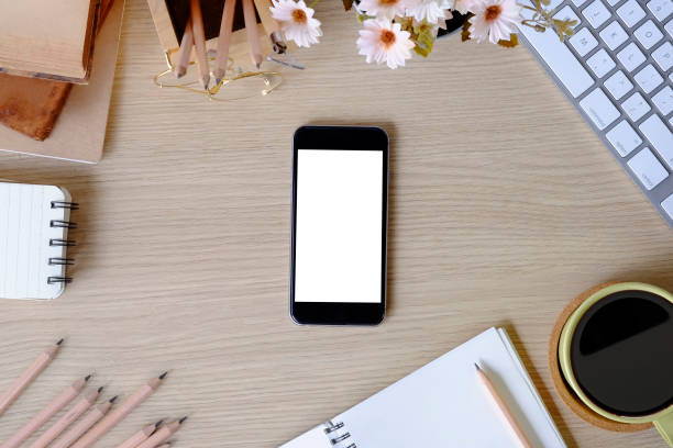 istock Top view office desk with mockup smartphone. 1079561192