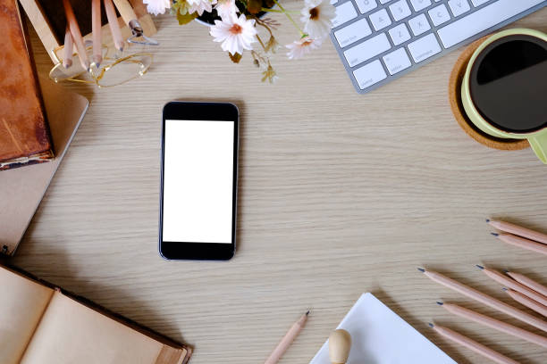 istock Top view office desk with mockup smartphone. 1079561338