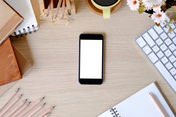 istock Top view office desk with mockup smartphone. 1079561342