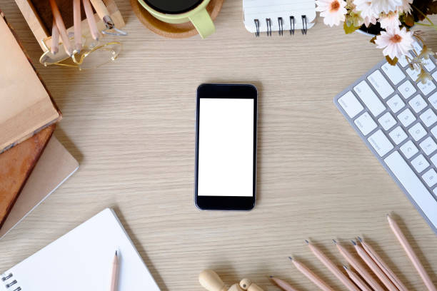 istock Top view office desk with mockup smartphone. 1079561412
