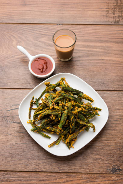 istock A savory cilantro cake or kothimbir vadi in square shape which is first steamed and then fried until crisp. popular indian snack served with hot tea and tomato ketchup 1079562620