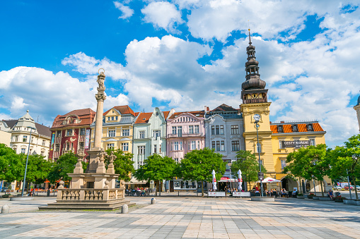 Ostrava, Czech Republic - July 4, 2016:  view showing Old town square or Masaryk Square in Ostrava and Museum building, tower, statues, trees and street restaurant can be seen on the background
