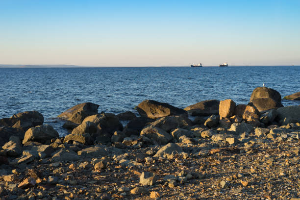 istock Seascape with beautiful sunset and ships on the horizon. 1079583582
