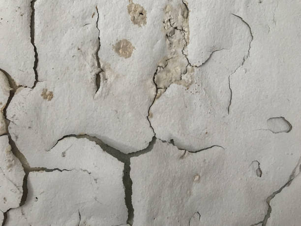 istock peeling painted like human face on wall background 1079585738