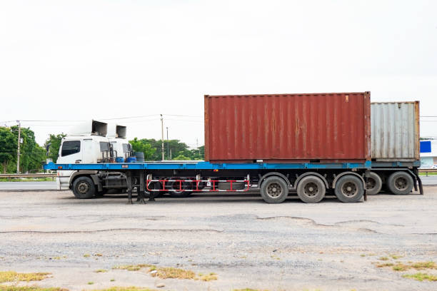 istock container trucks Logistic by Cargo truck on the road 1079591514