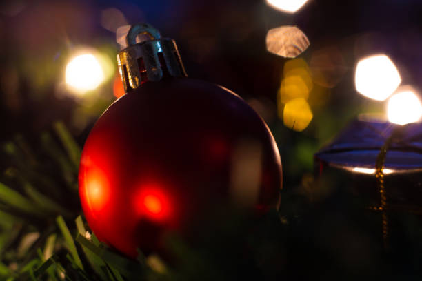 istock Red ball christmas ornaments on light bokeh backgrounds 1079599258