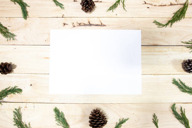 istock Christmas Frame with paper on wooden background 1079599484
