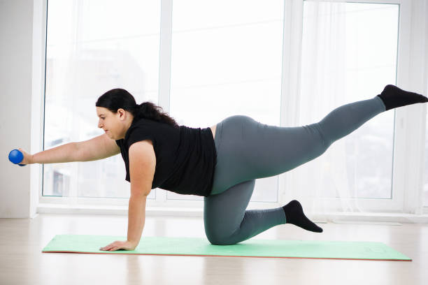 istock obese woman do isometric exercise during workout 1079604086