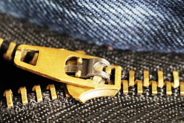 istock metal zipper and lock on jeans background, macro 1079608246