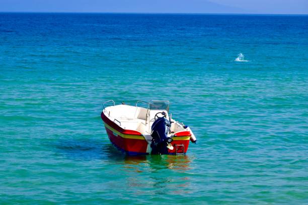 istock Small fishing boat in the sea. Empty. 1079610828