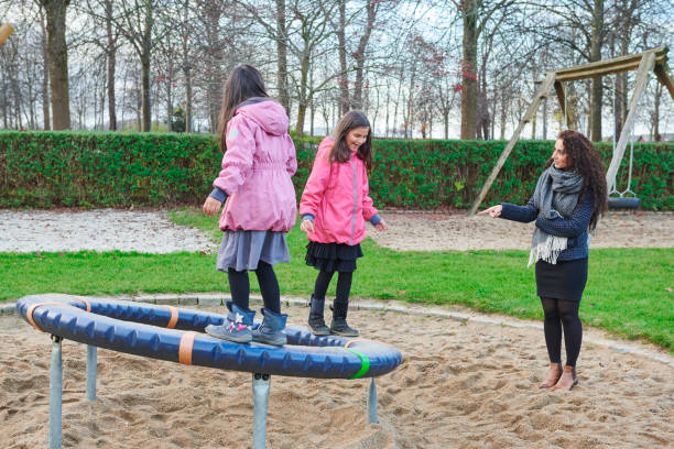 Pakistan immigrants in Denmark. Family living in flat in Horsens, Jutland. Divorced single mom with daughters. Having fun at the playground
