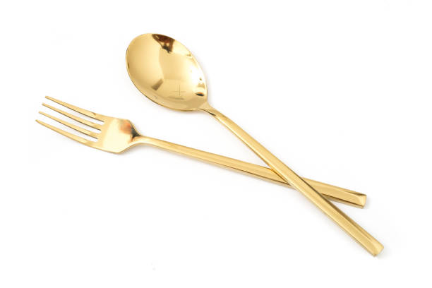 istock golden spoon and fork isolated on a white background 1079620868