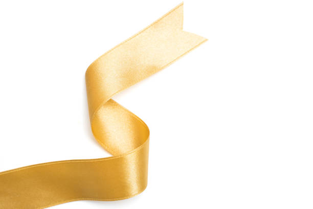 istock Gold ribbon in roll on white background 1079621008