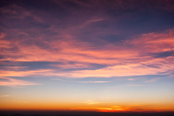 Gorgeous orange sunset colorful clouds in the evening sky, the natural beauty of nature