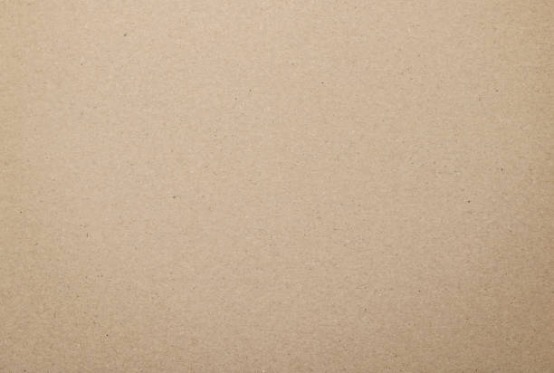 Cardboard background from old processing trash paper stock photo