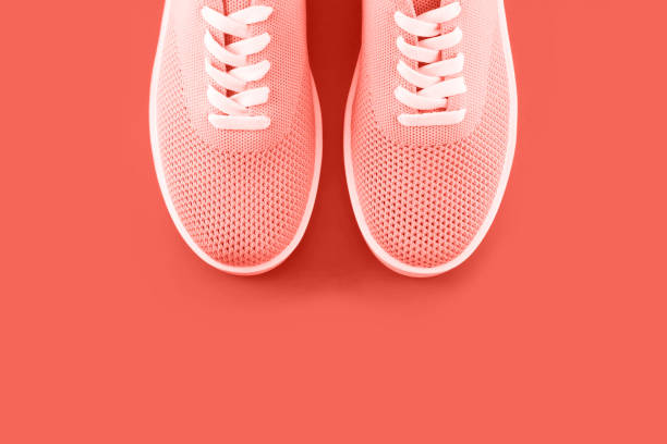 istock Bright orange sneakers on an orange background. 1079630134