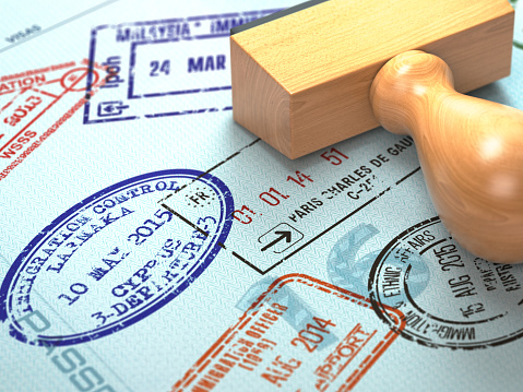 Pasaporte con sellos de visa. Fondo de concepto de viaje o turismo. photo