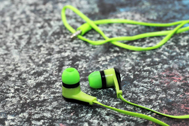 istock Green headphones on a chalkboard, a musical theme 1079634092