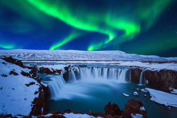istock Northern Light, Aurora borealis at Godafoss waterfall in winter, Iceland. 1079635952